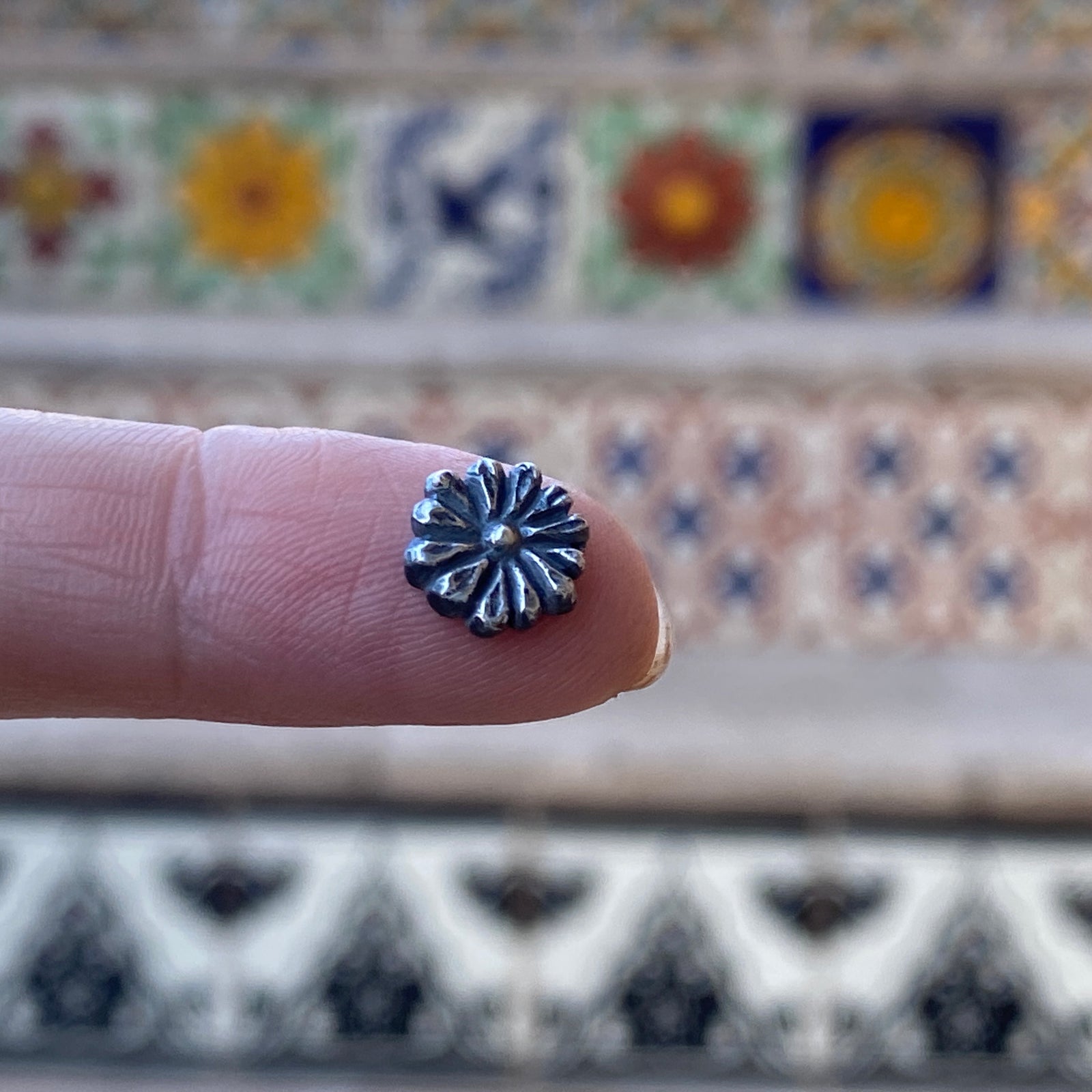 cast silver flower with patina